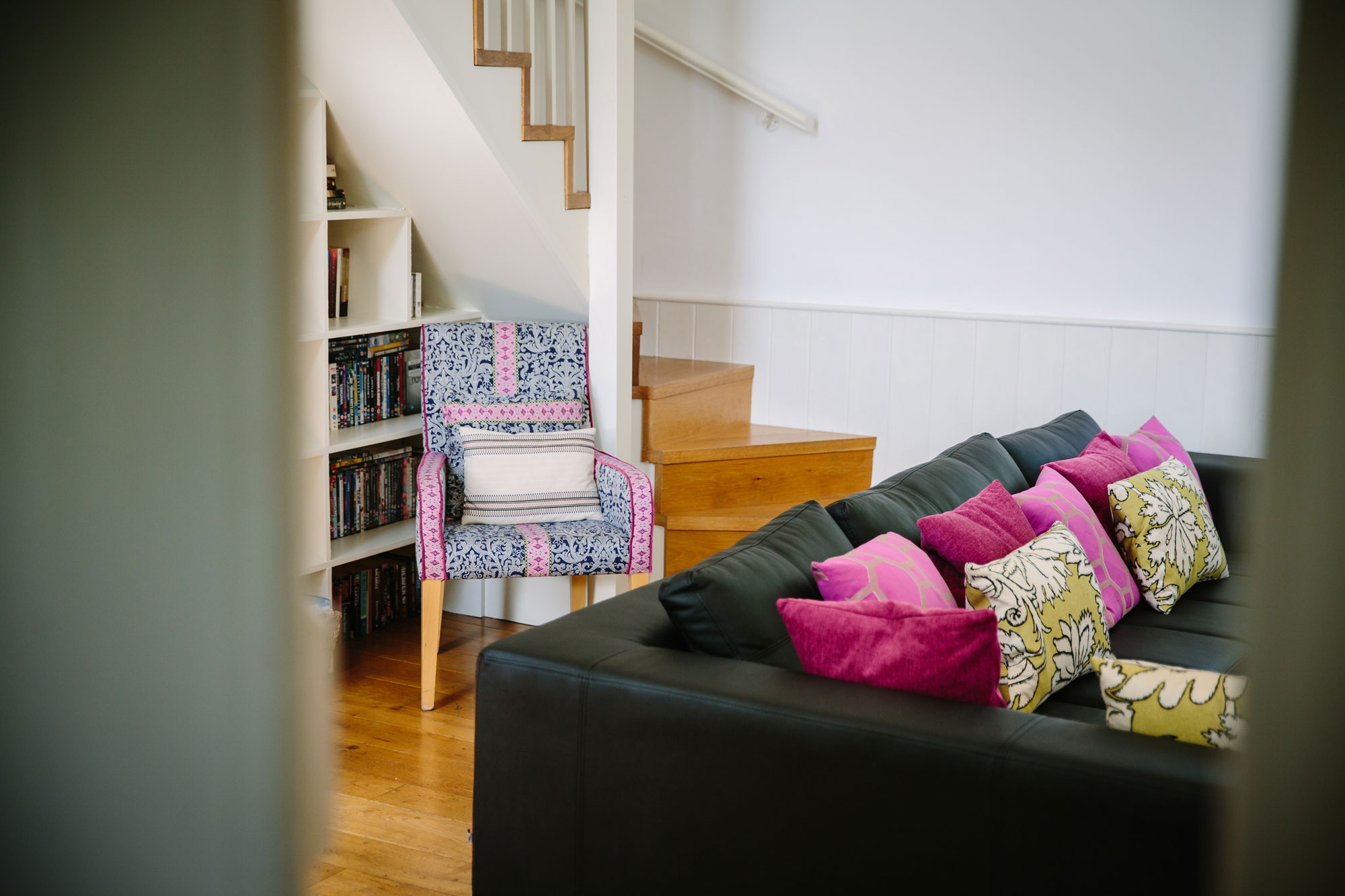 Stairs from the living room ascend up to the second bedroom suite