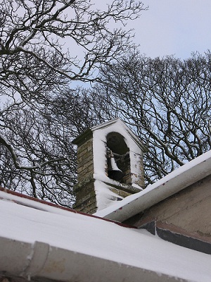 School bell in the snow