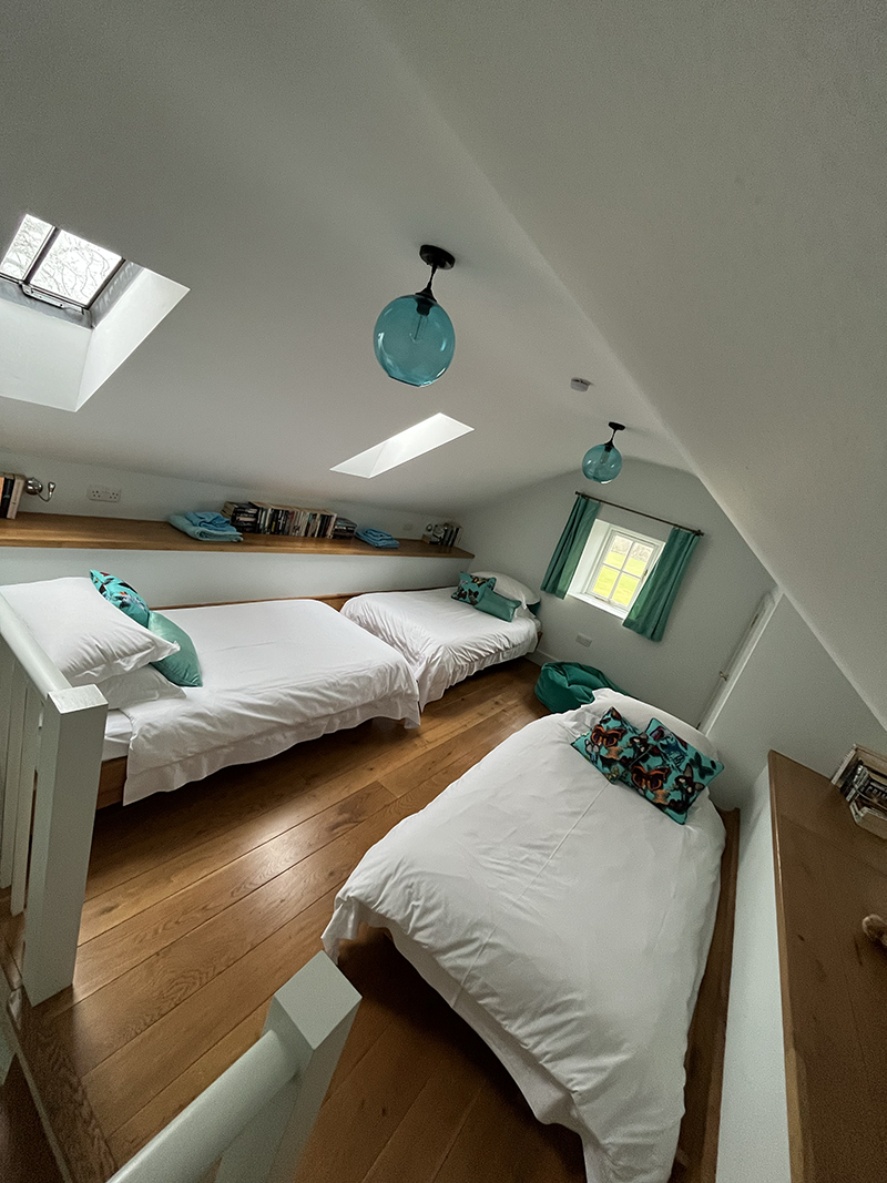 The third bedroom is designed to sleep three people comfortably